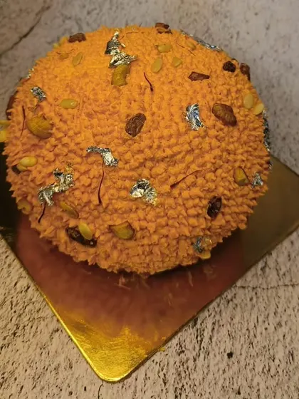Another view of our popular Motichur Laddu cake, showcasing the detailed texture that mimics the classic Indian sweet.