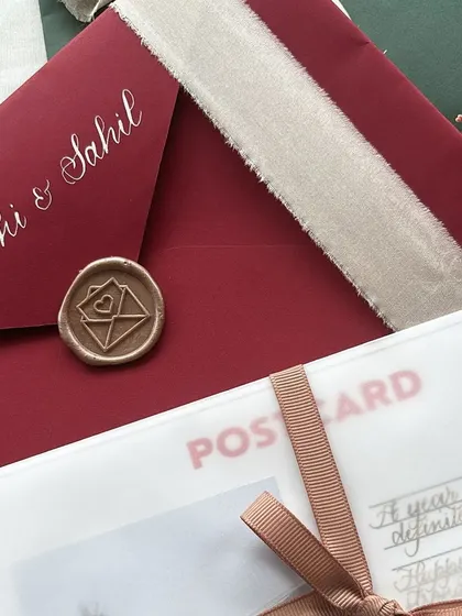 A lovely postcard birthday letter is a wonderful way to send your love. This design includes a personal polaroid photo and a handwritten message, all wrapped in a vellum sheet and tied with a ribbon.