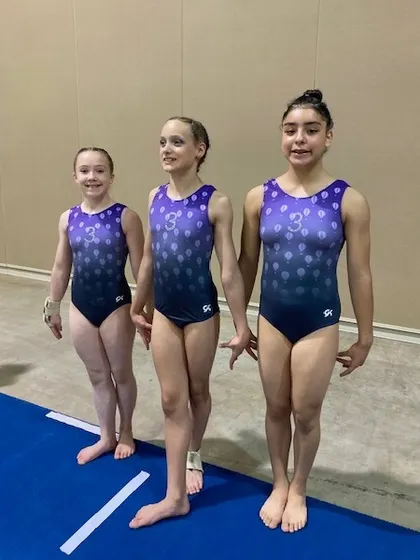 Three of our Level 7 athletes looking focused and determined at the regional meet.