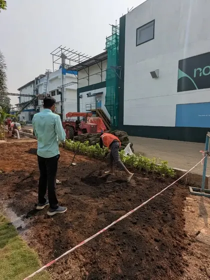 Here is a wide view of our industrial landscaping project for Novonesis. Our team is preparing a large patch of land adjacent to the existing lawn for rework and new planting.