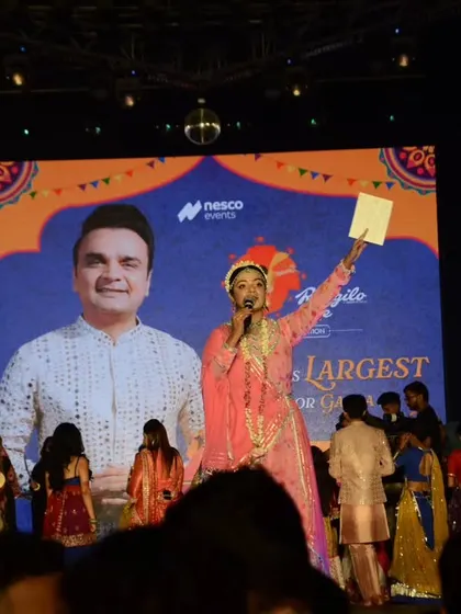 Leading the Maha-Aarti on Durga Ashtami at 'Rangilo Re'. This is a moment of pure divinity and collective prayer, and I was honored to guide thousands of people through this powerful ritual.