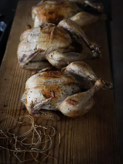 Whole chickens, trussed and ready for roasting. Our course covers essential butchery and preparation skills.