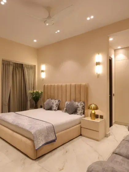 I designed this serene bedroom for a client’s mother, focusing on a soft cream-beige palette, a plush upholstered bed, and gentle lighting to create a heartfelt sanctuary.