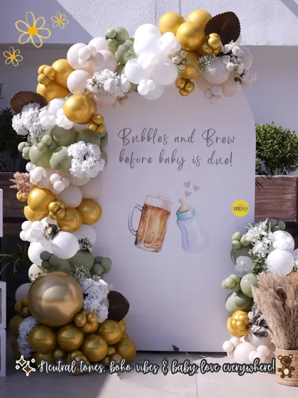 For this "Bubbles and Brew" themed baby shower, we created a fun and stylish balloon arch backdrop. The neutral tones of sage green, white, and gold chrome gave it a sophisticated yet playful vibe, perfect for celebrating the parents-to-be.