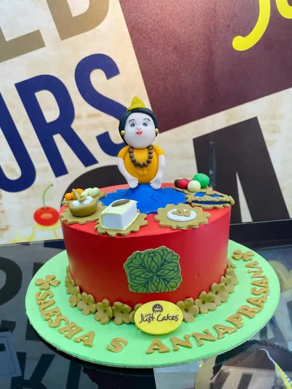 A 2kg cake for an Annaprasana (first rice-eating ceremony), with a traditional fondant figure and food items.