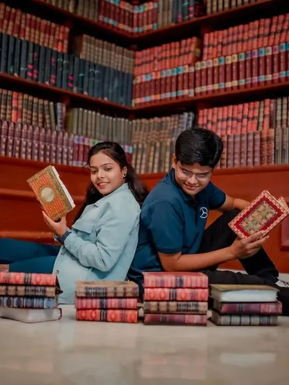 For the book-loving couple, a library-themed pre-wedding shoot is a perfect match. Here they are, sitting back-to-back amidst stacks of books, lost in their own stories.
