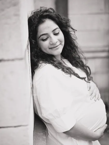 This is a simple, timeless black and white portrait of an expecting mother. My goal here was to capture the peaceful, inward-looking joy that defines pregnancy, creating a classic image she can cherish forever.
