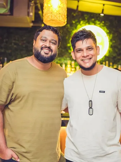 A happy, relaxed photo with a friend at the club.
