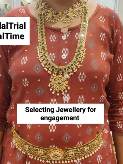 A client selecting jewellery for her engagement. She's trying on a classic gold-finish guttapusalu haram with a matching choker and vaddanam.