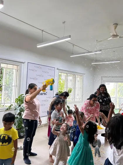 Our Holi celebration was full of color and fun, but also mindful of sustainability. Here, children and educators enjoy a bubble party, a water-safe way to celebrate.