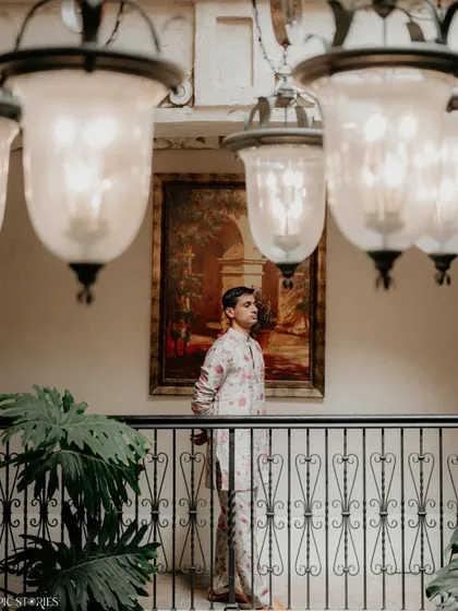 A portrait of the groom, Shafeen, at his Austin wedding. The composition, using the architectural elements of the Villa Antonia, creates a sense of depth and classic style.