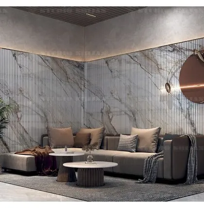 A close-up of the seating area in the Kirti Nagar lobby, highlighting the circular wall art and the soft, ambient lighting.