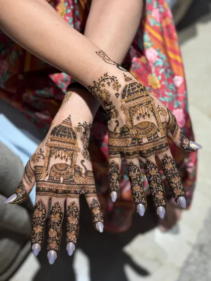A beautiful Karwachauth design featuring traditional palanquin and elephant motifs.