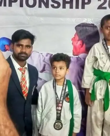 Young champions on the podium at a national karate championship in Mumbai.