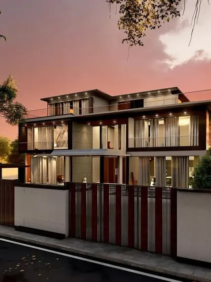A dusk render of a luxury home, showing how the landscape and architecture are designed to capture the beauty of the setting sun. The large windows reflect the colorful sky, blending the home with its environment.