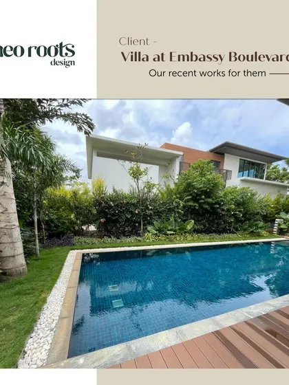 A duplicate of image 11, showing the modern villa poolside.