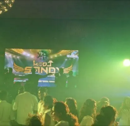 A corporate party with my logo displayed on the LED screen, reinforcing my brand presence.