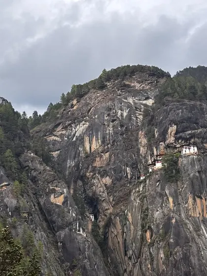 This is the world famous Tiger’s Nest Monastery in Bhutan, seen from the trail. The monastery clings to a sheer cliff face, and the trek to reach it is the main highlight of my 7-day all-inclusive Bhutan trip. The view itself is worth the journey.