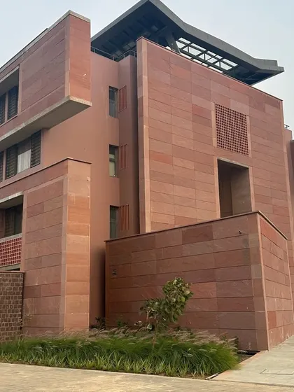 A duplicate image of the facade of the Azim Premji University building.