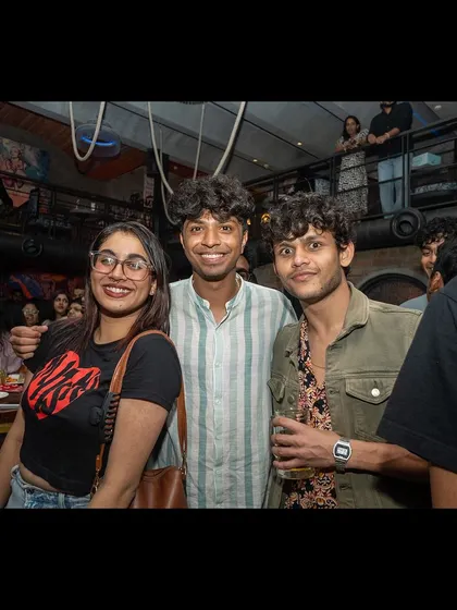 A group of friends enjoying the vibrant energy of the night.