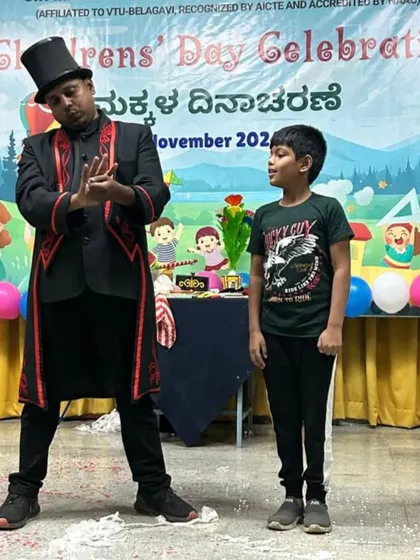 The best part of my job is seeing the look of amazement on a child's face. Here I am with a young volunteer on stage during a Children's Day celebration, sharing a moment of magic together. Audience participation is key to my shows.