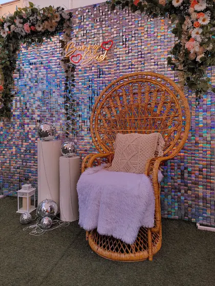 A full view of the sequin backdrop setup, showing its versatility for events like a baby shower, haldi, or mehndi. The shimmering wall catches the light beautifully, creating a dynamic and celebratory background.