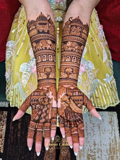A beautiful design for an NRI bride from the US, featuring classic bride and groom portraits with royal elephants and peacocks.