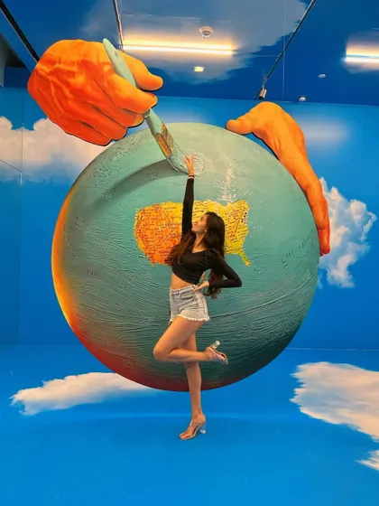 A classic ballet passé pose in front of this amazing art piece. Dance is art, and art inspires dance.