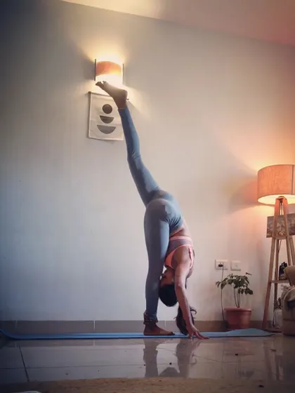 A standing split pose, or Urdhva Prasarita Eka Padasana, showcasing incredible flexibility and balance. This pose stretches the hamstrings and strengthens the legs.