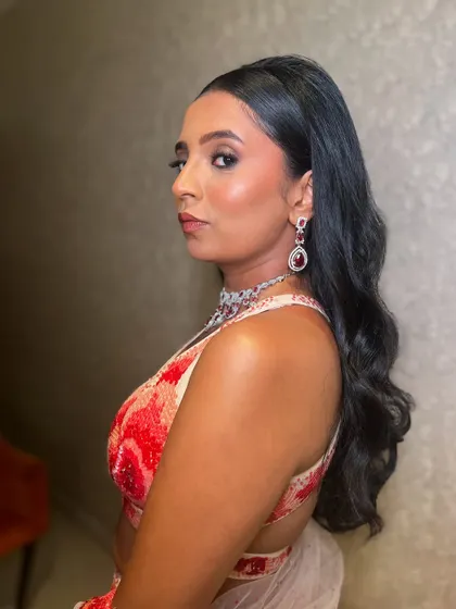 A portrait of the client, her Hollywood waves adding to her sophisticated look.