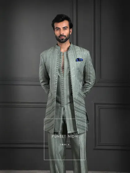In the calmness of sage green lies a quiet grandeur. This ensemble is tailored to perfection, with a structured silhouette that flows effortlessly, exuding timeless sophistication.