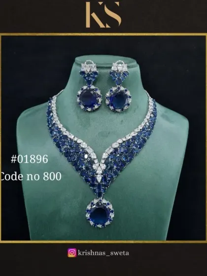 A premium quality American Diamond set in a stunning royal blue. This V-shaped necklace is designed to be a modern statement piece.