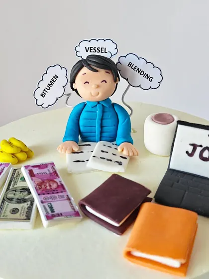A close-up of the fondant figurine for a friend's birthday cake. The thought bubbles represent his work in the shipping industry, with terms like "vessel," "bitumen," and "blending."