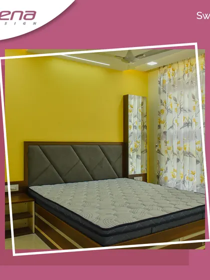 A simple yet vibrant bedroom design. The yellow accent wall brings energy to the space, complemented by a bed with a grey geometric-patterned headboard.