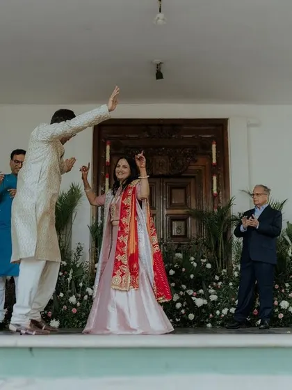 The couple dancing joyfully during their Bhaat ceremony.