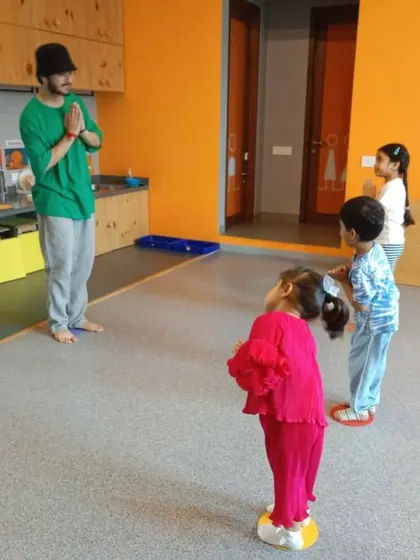 Our instructors begin each class by connecting with the students, often with a simple 'namaste', creating a respectful and focused learning environment.