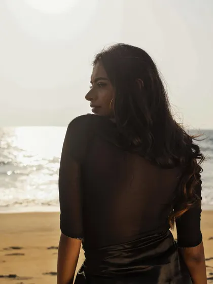 A profile shot from the 'Tide' beach series, with the setting sun creating a beautiful silhouette.