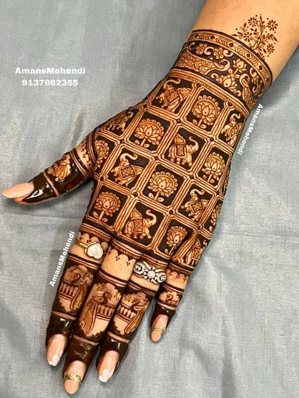 A modern take on traditional motifs, this back-of-hand design features a clean grid pattern. Each square is filled with alternating elephant and lotus symbols, creating a look that is both contemporary and classic.