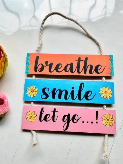 A daily reminder to "breathe, smile, let go." This colorful hanging is perfect for creating a calm and happy corner.