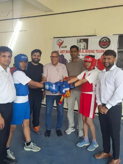The pre-fight moment where boxers and coaches come together in the ring, showing sportsmanship before the match begins.