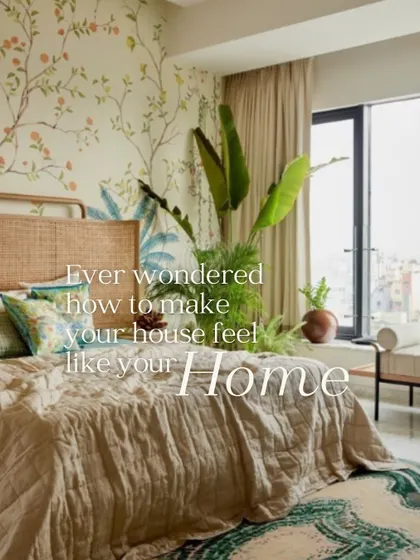 A light and airy bedroom with a botanical wallpaper featuring climbing vines and citrus fruits. It brings a fresh, organic feel to the space, making it feel like a home.