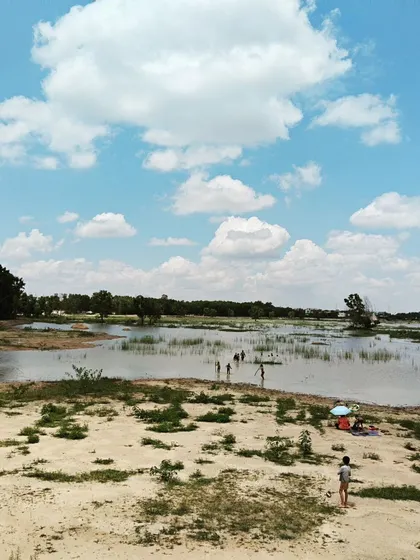 A day spent harvesting clay from a lake bed is a full-body sensory experience. This wide view captures the scale of our outdoor adventures, where learning is tangible, messy, and deeply connected to the earth.