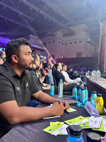 The best seat in the house. Judging at MFN 13, completely absorbed in the fight.