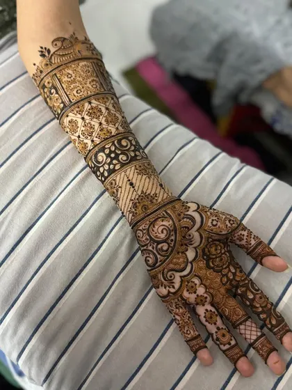 This is a detailed view of my intricate bridal henna work. Each design is unique, combining traditional patterns like paisleys and mandalas with fine-line fillers to create a stunning, full-coverage look for your special day.