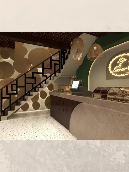 The counter and staircase area of the 'Sip & Savor' cafe. The design uses a mix of materials, including a terrazzo counter, fluted wood panels, and a decorative wall feature, to create a textured and visually engaging service point.