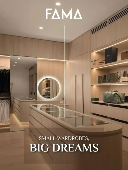 This image is identical to 48 and showcases a compact yet highly effective wardrobe design. The use of light wood and a glass-topped island creates a sense of openness, making it a perfect solution for smaller rooms.