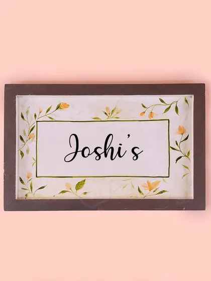 A personalized version of our floral nameplate for the Joshi family. The classic design and hand-painted script make it a timeless and popular choice.