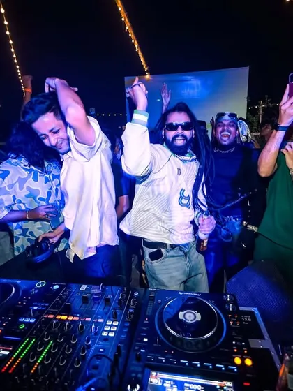 The party in full swing, with everyone dancing and capturing the moment.