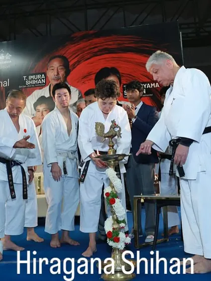 Hiragana Shihan participating in the lamp lighting ceremony to inaugurate a JKA event. These traditions signify the passing of knowledge and the auspicious start of a training camp.