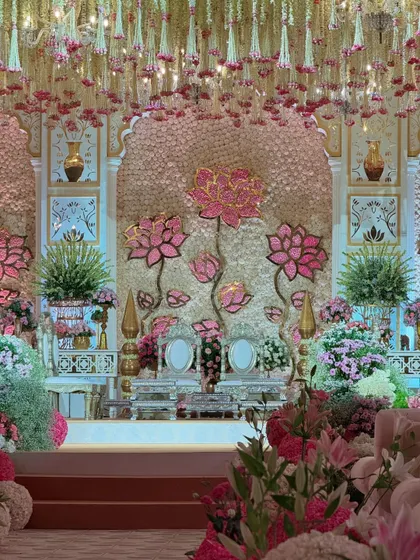 A closer view of the stage, where oversized lotus motifs create a stunning focal point. The design is a perfect blend of traditional symbolism and contemporary artistry.